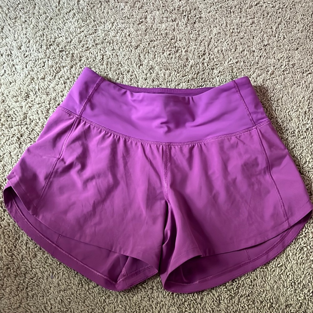 Lululemon Speed up Mid rise 4” shorts (Vivid plum).  Elastic liner part cut